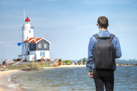 The man on the background of the Lighthouse in the Dutch old village in Volendam.の写真素材