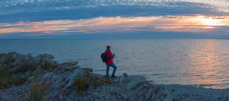 man at sunset by the sea. Shot on drone