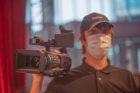 masked journalists interviewing during a pandemic. Covid-19