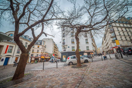 Montmartre, France. Street with houses. Sunset in parisのeditorial素材
