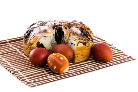 Easter eggs and cake on the mat isolateの写真素材