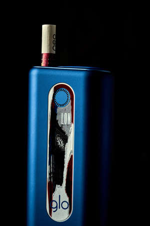 Glo with purple neo stick black isolated backgroundのeditorial素材