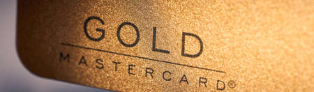Gold mastercard credit card written on the card