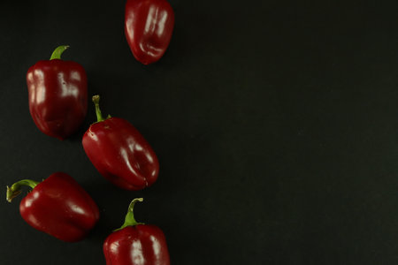 Red peppers on black backgroundの写真素材