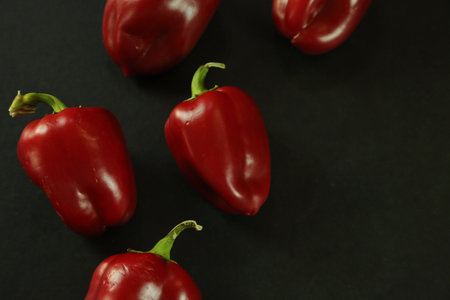Red peppers on black backgroundの写真素材