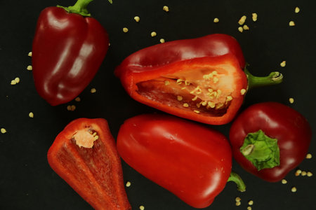 Red peppers on black backgroundの写真素材