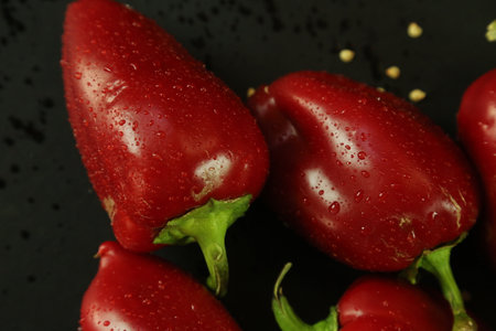 Red peppers on black backgroundの写真素材