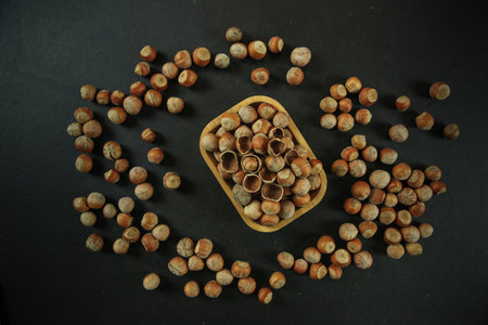 Hazelnuts on wooden backdrop. heap or stack of hazelnuts. healty foodの写真素材