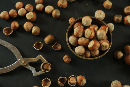 Hazelnuts on wooden backdrop. heap or stack of hazelnuts. healty food
