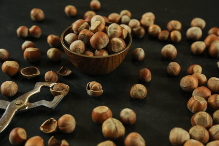 Hazelnuts on wooden backdrop. heap or stack of hazelnuts. healty foodの写真素材
