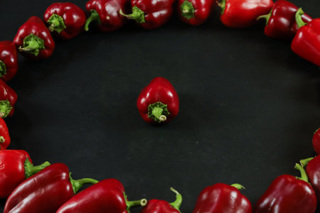 Red peppers on black backgroundの写真素材