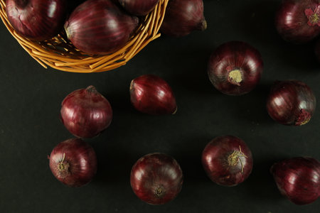 sweet red onions on backgroundの写真素材