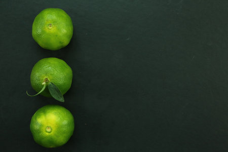 Green sweet tangerines growing with backgroundの写真素材