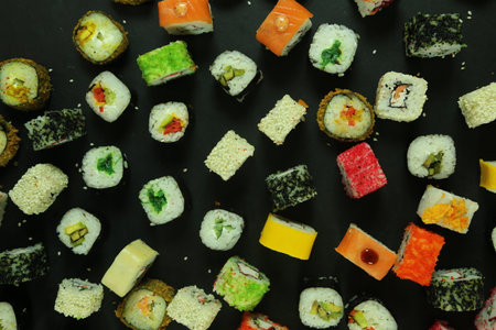 Sushi roll with salmon, tuna, avocado and cucumber. A lot of rolls. Sushi rolls.の写真素材