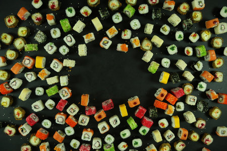 Sushi roll with salmon, tuna, avocado and cucumber. A lot of rolls. Sushi rolls.の写真素材