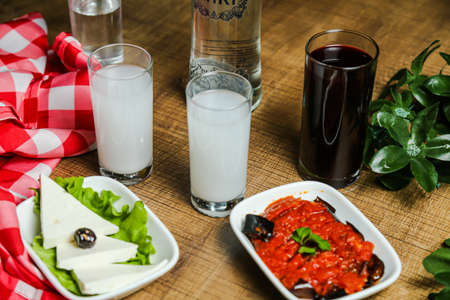 National Turkish alcoholic drink Raki and appetiser on tableの写真素材