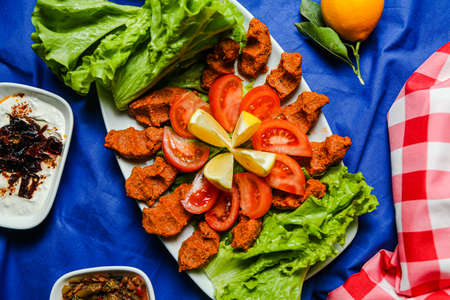 Cig kofte, a raw meat dish in Turkish with turkish drinkの写真素材