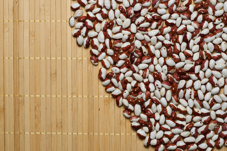 white red beans on a bamboo background
