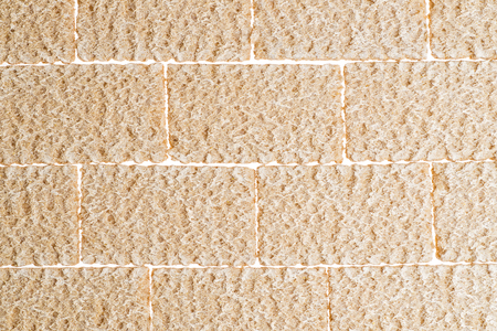 crispy bread crisp lined with bricks on white backgroundの写真素材