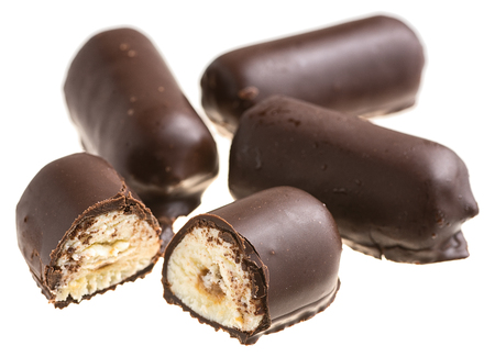 Chocolate sweets with white filling and half-cut candy