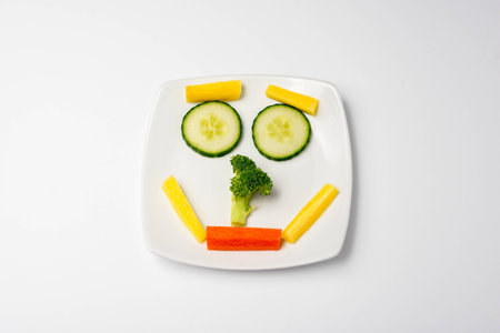 Veggie face smile on plateの写真素材