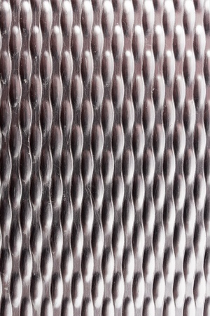 Dotted metal plate. Shiny steel.の写真素材