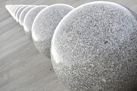 Grey granite spheres. From biggest to smallest.の写真素材