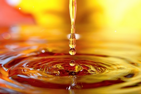 Liquid autumn. Drops of water and orange leafs.の写真素材