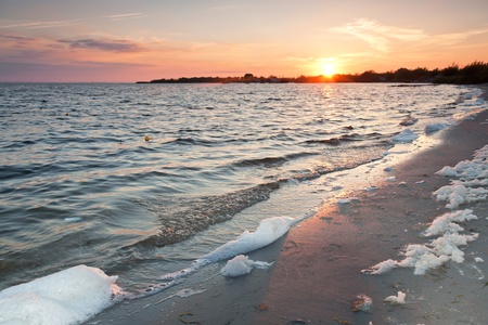 Sunset at Baltic sea.Dirty beach.の写真素材