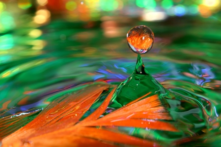 Optimistic rain. Colored drops of water.