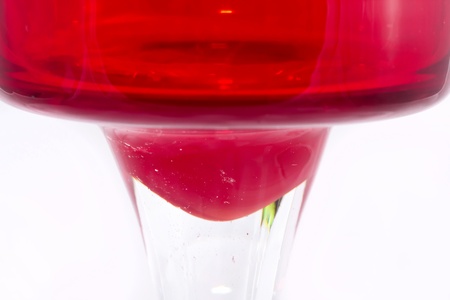 Red cocktail glass isolated on white background の写真素材