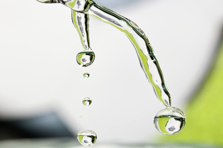 Drops of clear water with reflection of soccer ball の写真素材