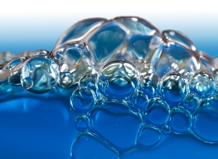 Blue bubbles in clear water の写真素材