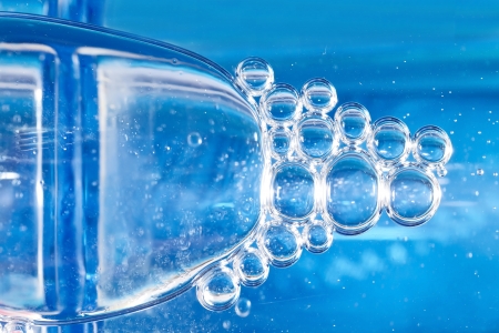 Blue bubbles in clear water の写真素材