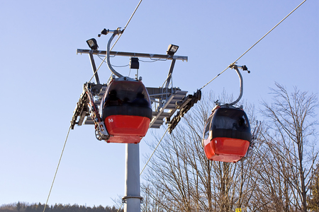 Ski station in Polish mountain. Red gondola.の写真素材