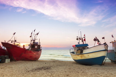 Sights of Poland. Sunset at Baltic sea with fishing boats.の写真素材