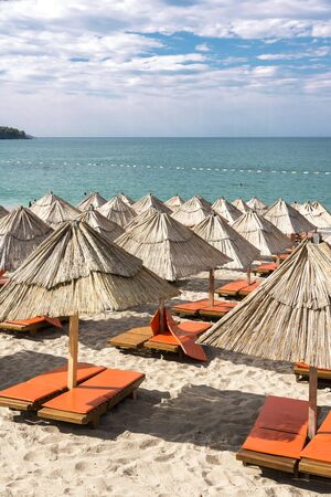 Sunny beach and blue sea on Mediterranean coast.の写真素材