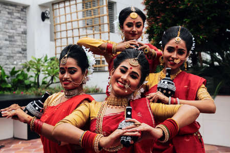 Dhaka, Bangladesh - September 23, 2020: Young pretty bengali girls are ready for a dance performance in the cultural program. Before going to the stage, they are continuing their rehearsal for bettermのeditorial素材