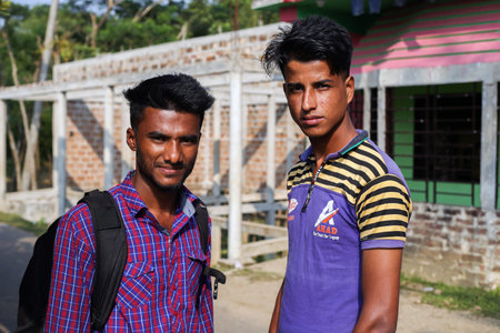 Gowainghat, Bangladesh - November 06, 2019: Young Asian men standing in front of the construction...