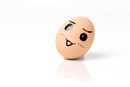 Creative painted egg on white backgroundの写真素材