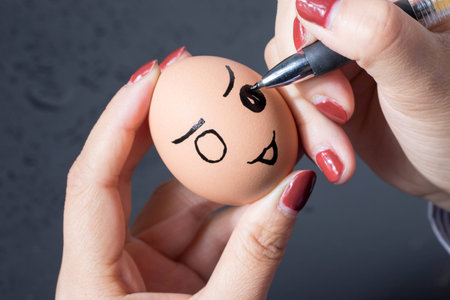 Girl painting on the eggの写真素材