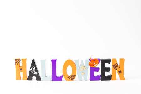 Happy Halloween wooden letters with pumpkins, spiders and other decorationsの写真素材