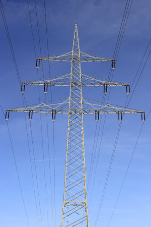 Electricity pylon in the blue sky. Energy transition environment. Symbol for electricity and energy transition.