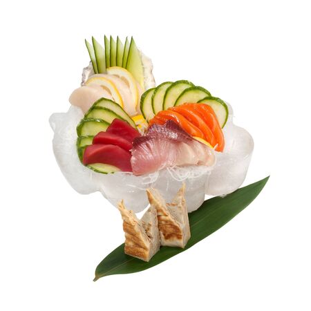 Sashimi set with raw fresh scallops, sea bass, tuna, salmon, cucumber, rice noodles. Isolated on white backgroundの写真素材