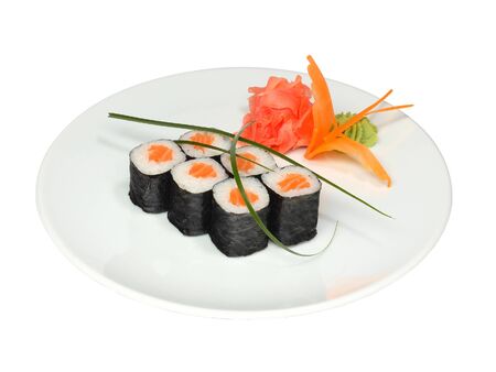 Sushi rolls with salmon and nori with pickled ginger and wasabi on white round plate. Close-up of delicious japanese food with sushi roll isolated on white backgroundの写真素材