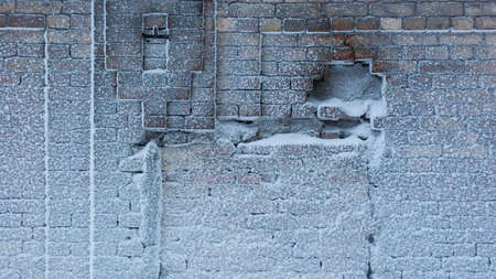 Old rough snow covered brick texture natural background. With copy space