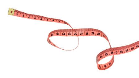 Close-up of pink tape measure isolated on white background