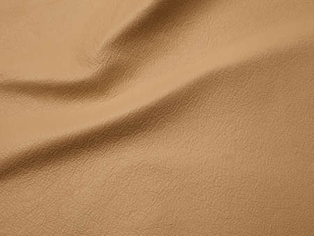 Genuine beige cattle leather texture background. Macro photoの写真素材