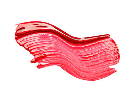 Smudged red lip gloss sample isolated on white backgroundの写真素材