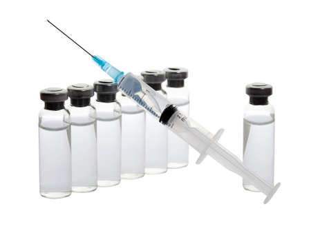 Close-up medical syringe and vials with medicine for injection. Isolated on white backgroundの写真素材